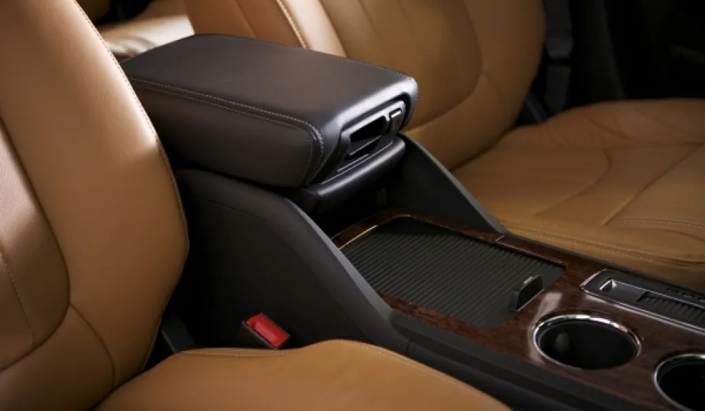 Luxury vehicle interior with leather seats and armrest