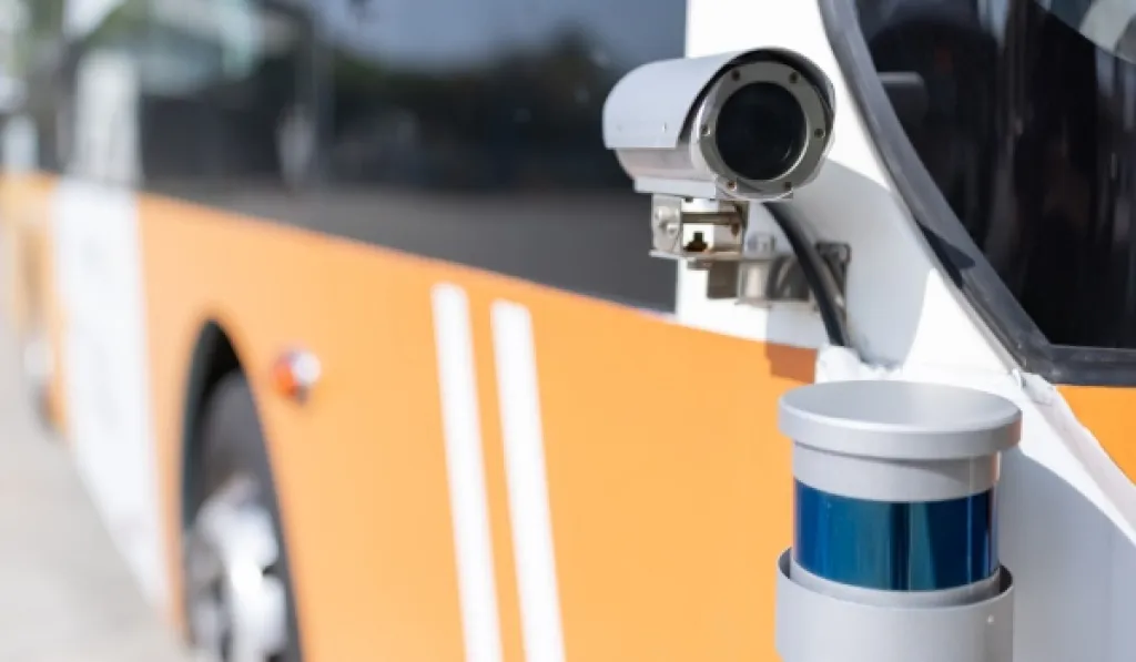 CCTV camera mounted on city bus for security and passenger safety monitoring.